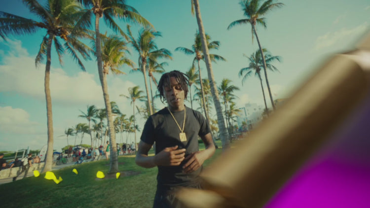 3D overlays in use: flying cars, double cups, caution tape and money over a music video